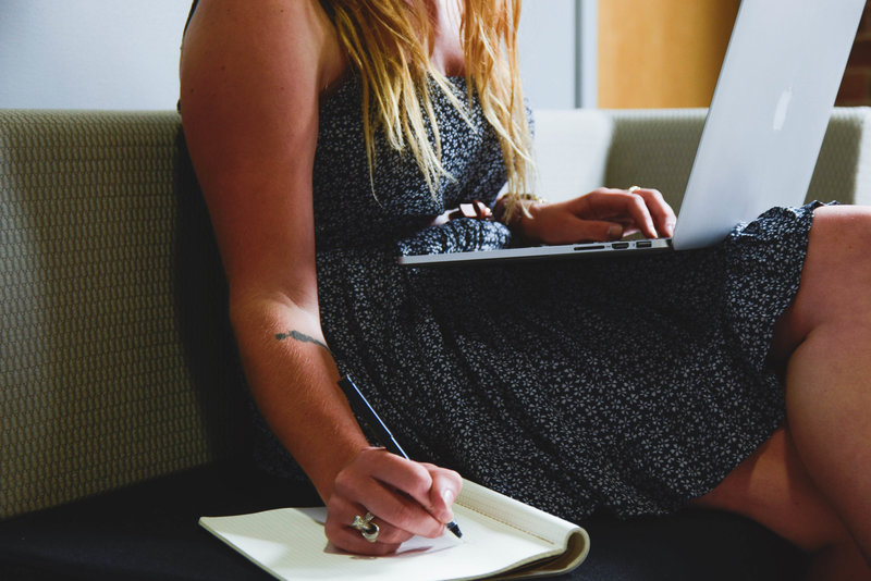 girl using jargon buster to make notes