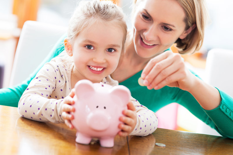 mother teaching her child money management