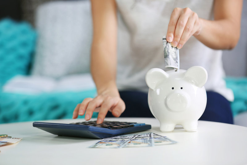 girl calculating if she can afford to start saving for retirement