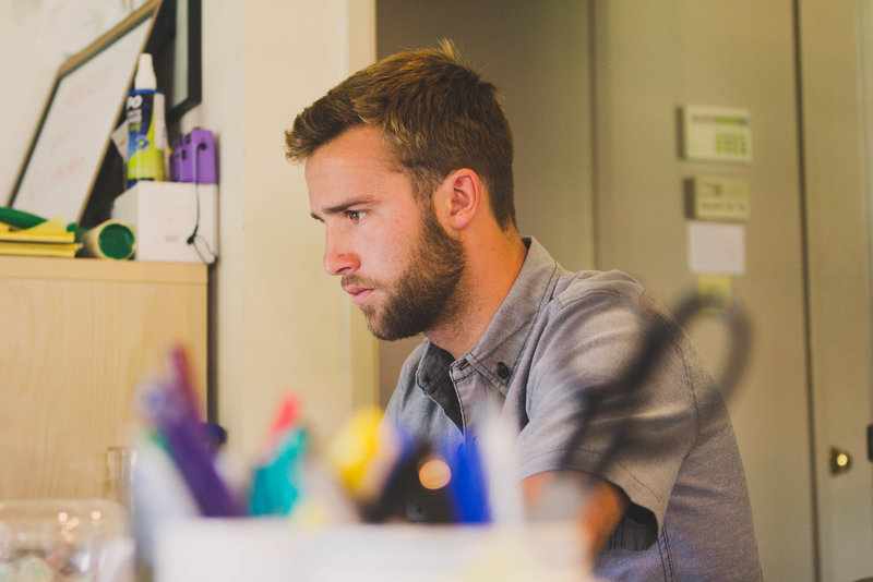 boy creating a student budget planner