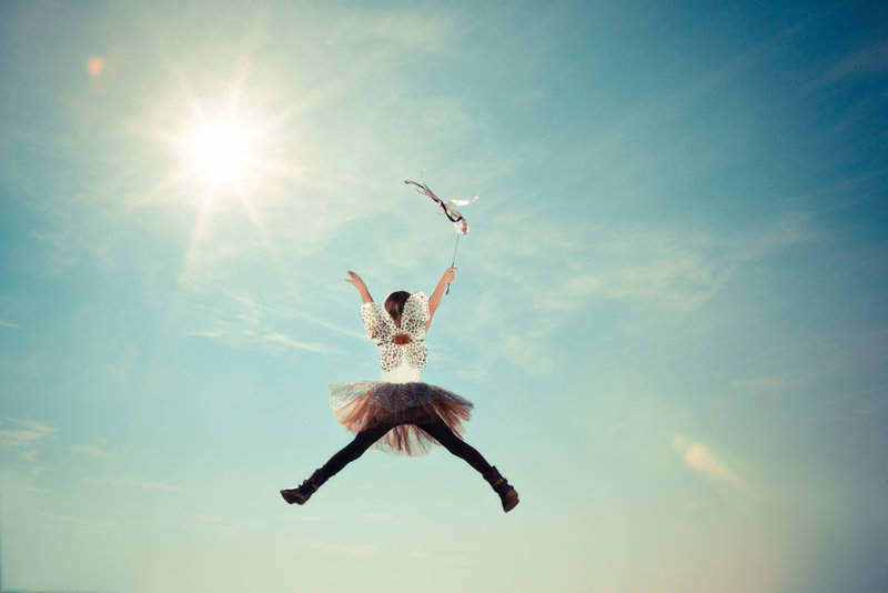 saving for children young girl jumping into sky