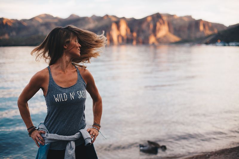 Woman stood by water