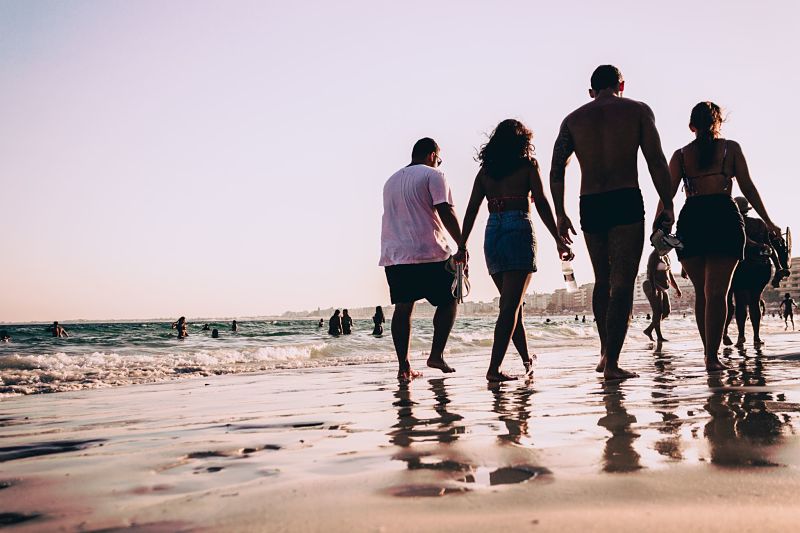 Family walking down the beach