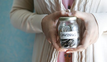 Money jar with 'savings' written on it