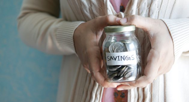 Money jar with 'savings' written on it